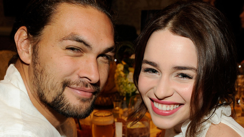 Jason Momoa and Emilia Clarke at an event