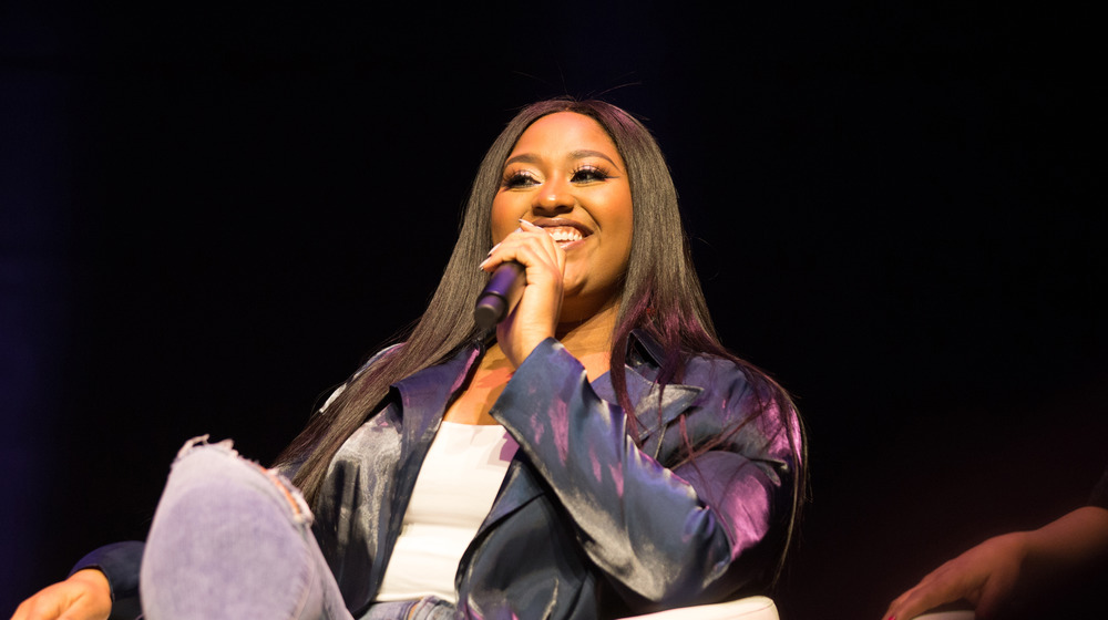 Jazmine Sullivan speaking at an event