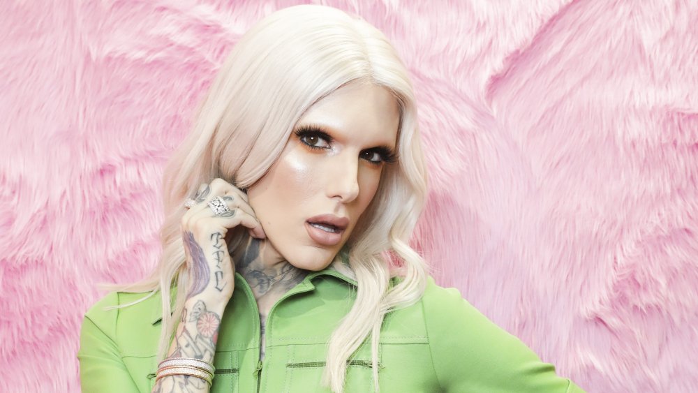 Jeffree Star in a green jumpsuit 