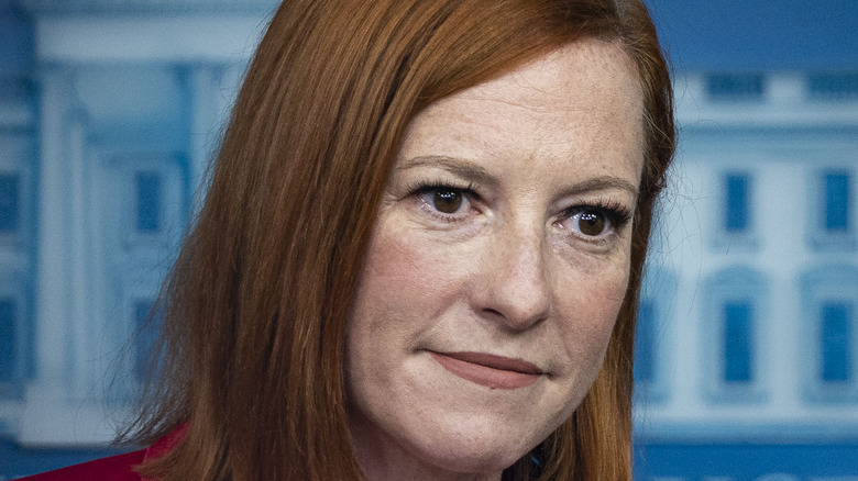 Jen Psaki at a White House briefing (pink suit)