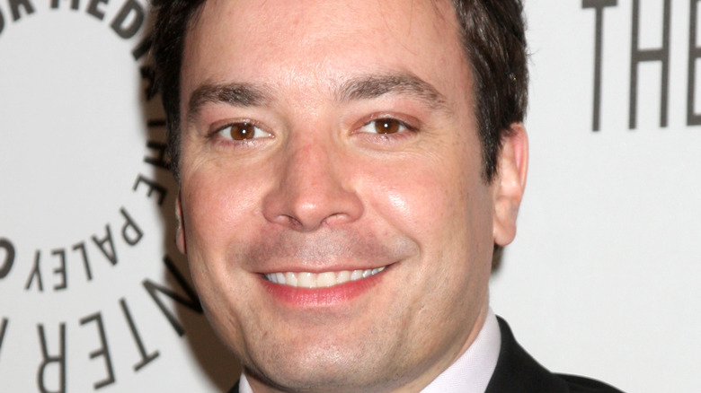 Jimmy Fallon smiling for a picture at an event
