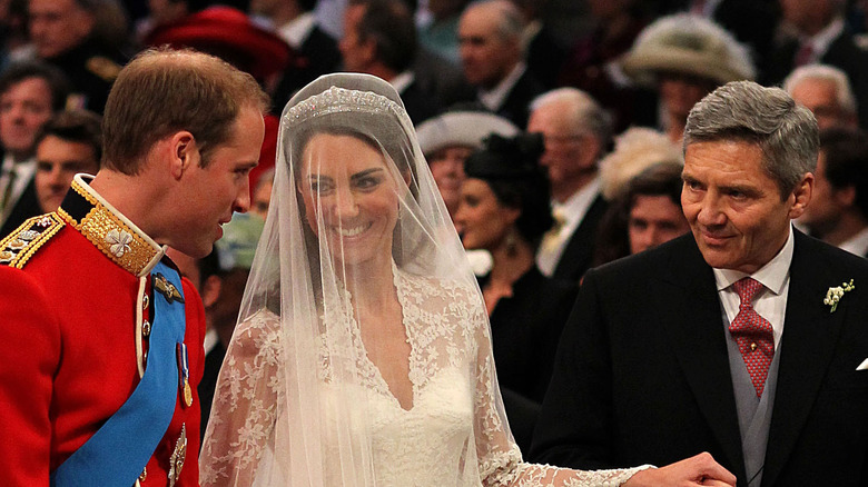 Kate Middleton and Prnce William alongside Michael at their wedding 