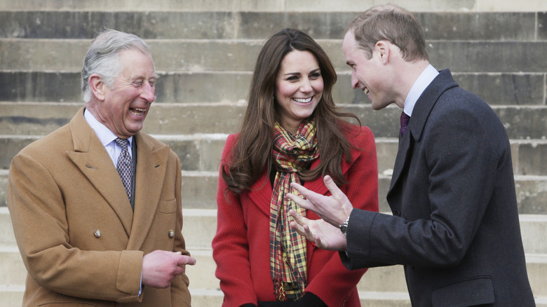 King Charles, Kate Middleton and Prince William sharing a laugh
