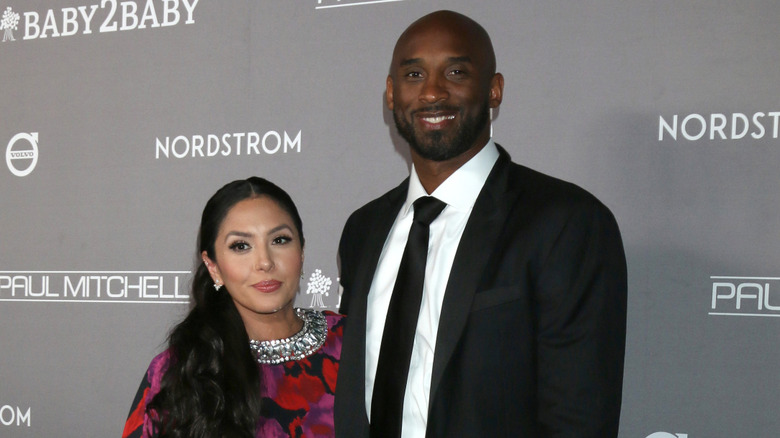 Kobe and Vanessa Bryant looking at the camera