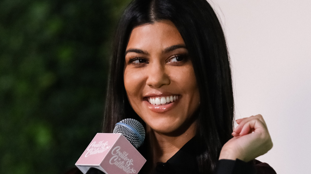 Kourtney Kardashian smiling