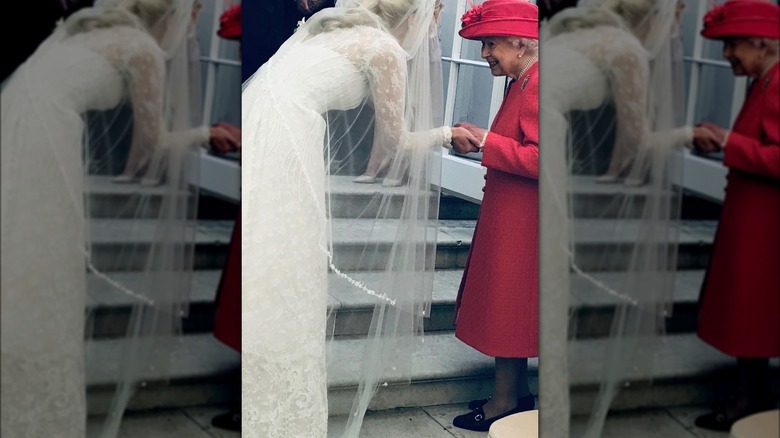 Lady Gabriella Windsor holding hands with Queen Elizabeth II