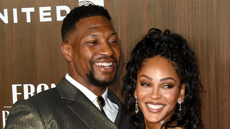 Jonathan Majors and Meagan Good smiling