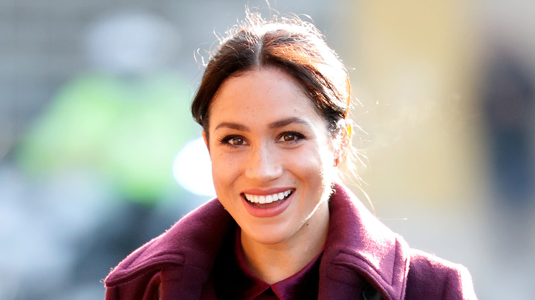 Meghan Markle smiles at camera 
