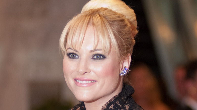 Meghan McCain smiles rocking a bang and high bun