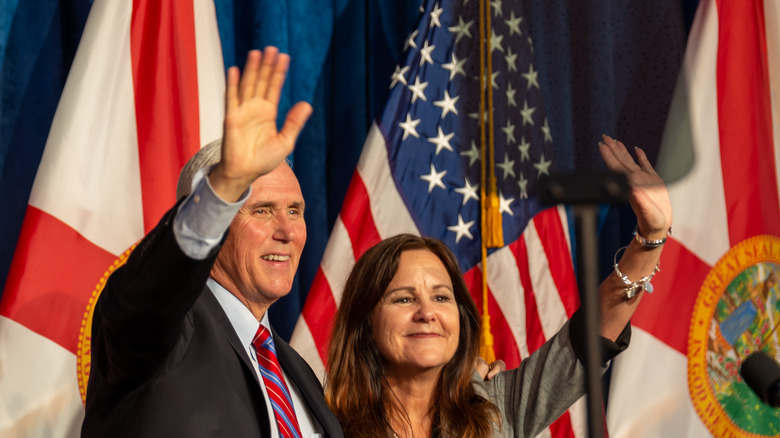 Mike and Karen Pence smiling and waving 