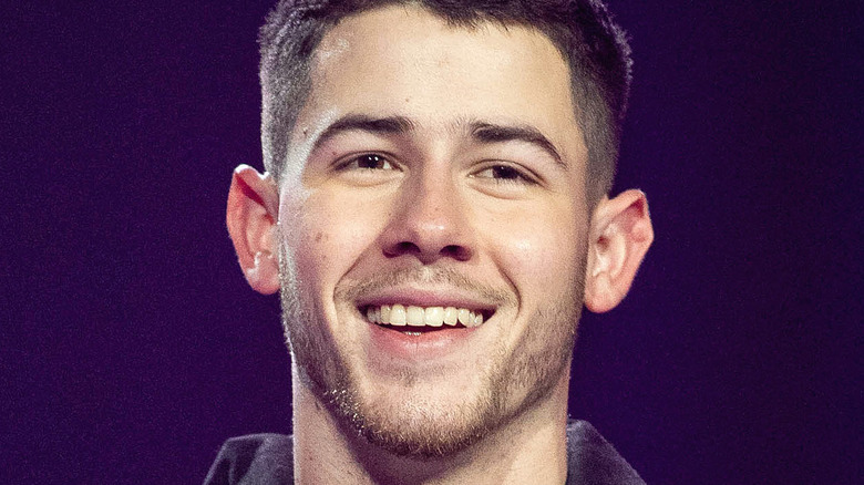 Nick Jonas smiles