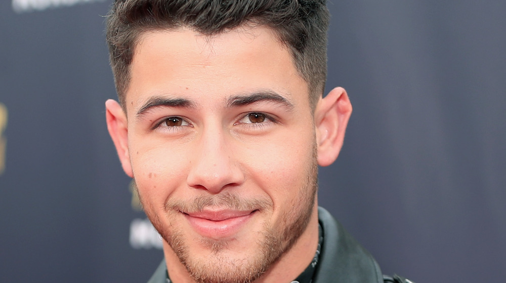 Nick Jonas grinning