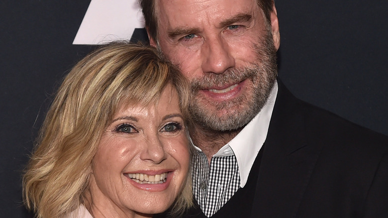 Olivia Newton-John and John Travolta smiling 