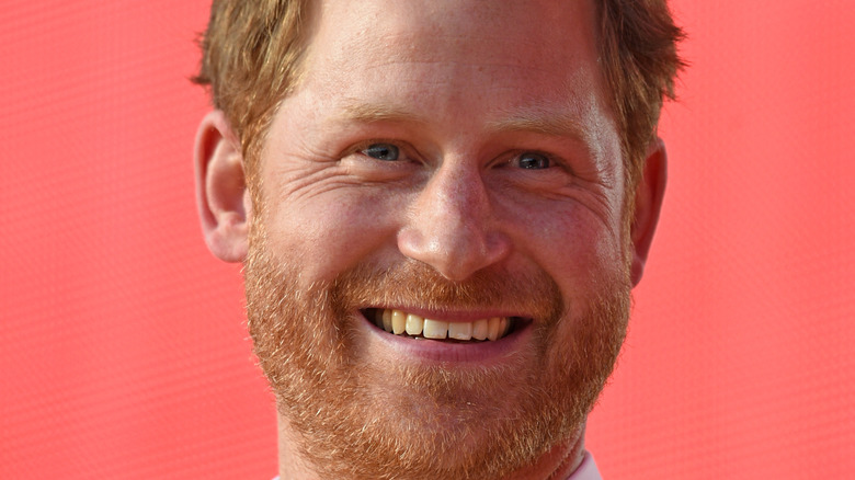 Prince Harry smiling on the red carpet