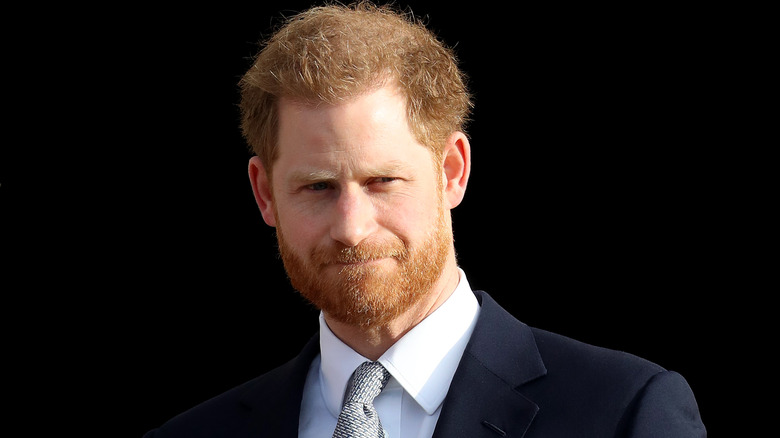 Prince Harry wearing gray tie and black blazer