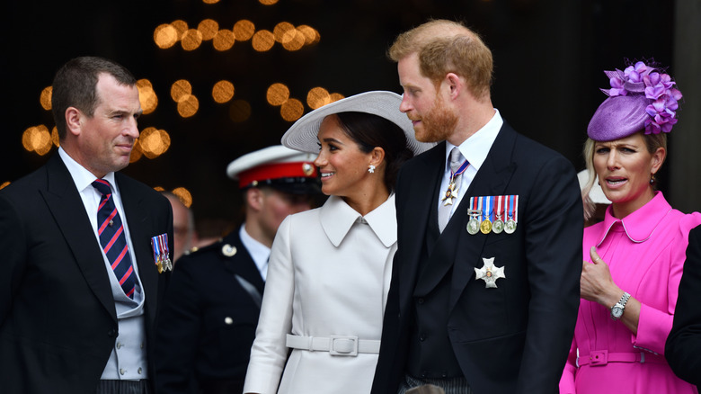 Peter Phillips, Meghan Markle, and Prince Harry making conversation after the Platinum Jubilee church service