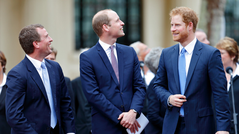 Peter Phillips, Prince William, and Prince Harry laughing