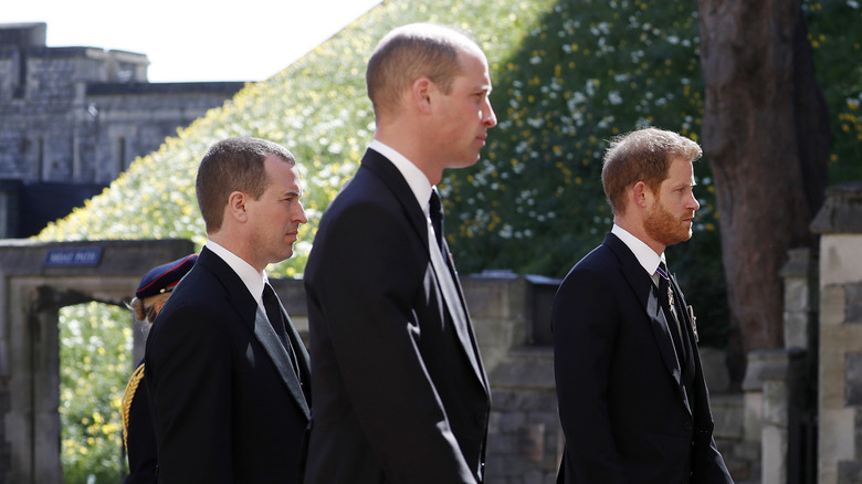 Peter Phillips walking between Prince William and Prince Harry at Prince Philip's funeral