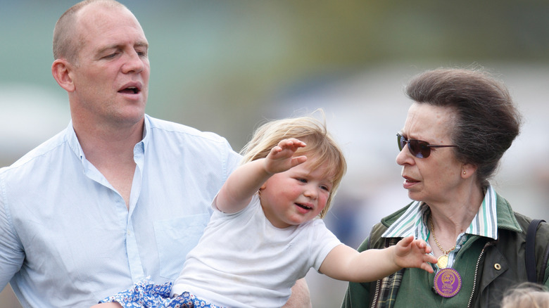 Mike Tindall and Princess Anne looking at Mia