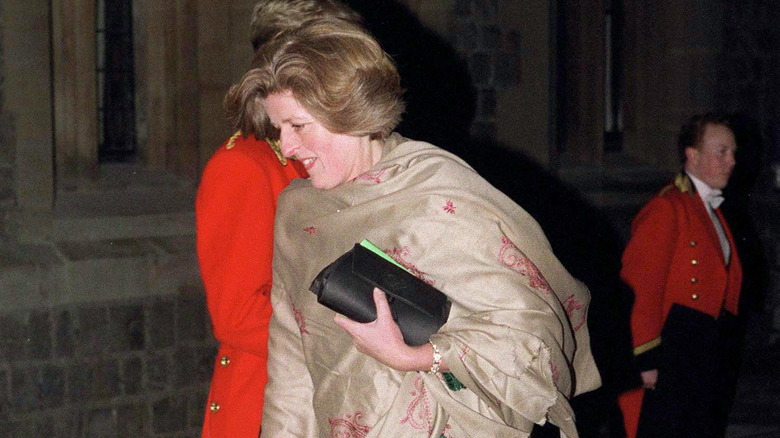 Lady Jane Fellowes walking past royal footmen
