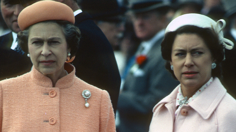 Queen Elizabeth and Princess Margaret standing together