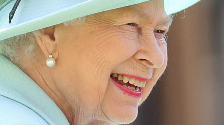 Queen Elizabeth smiling in profile 