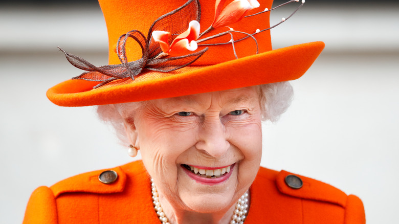 Queen Elizabeth in orange hat