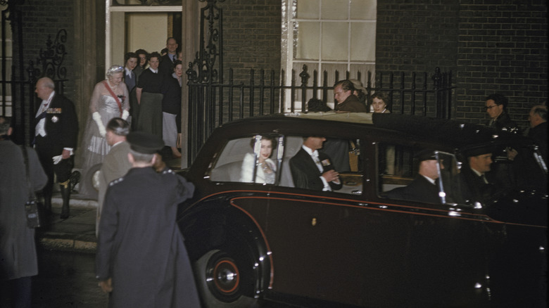 Queen Elizabeth and Prince Philip in car