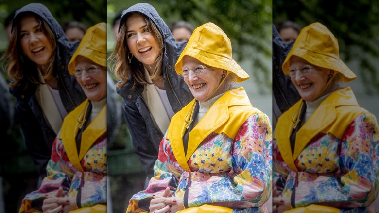 Queen Margrethe and Mary share a laugh on a rainy day