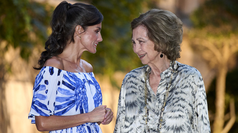 Queen Letizia and Queen Sofia smiling