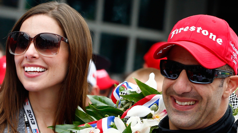 Tony Kanaan and wife Lauren at a race