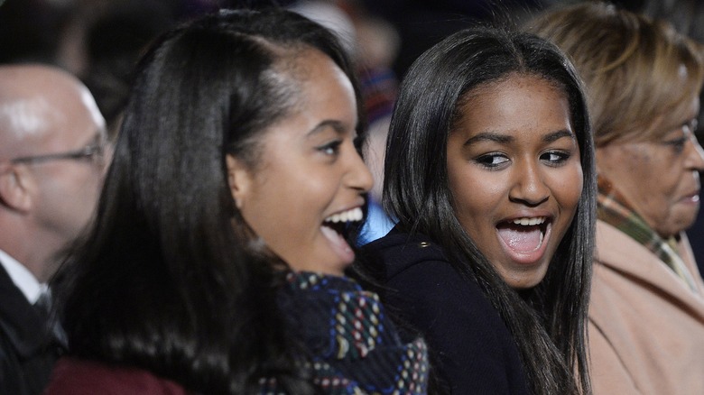 Sasha and Malia Obama smiling