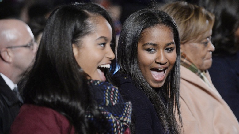 Malia and Sasha Obama laughing