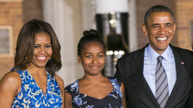 Sasha Obama poses with parents Barack and Michelle