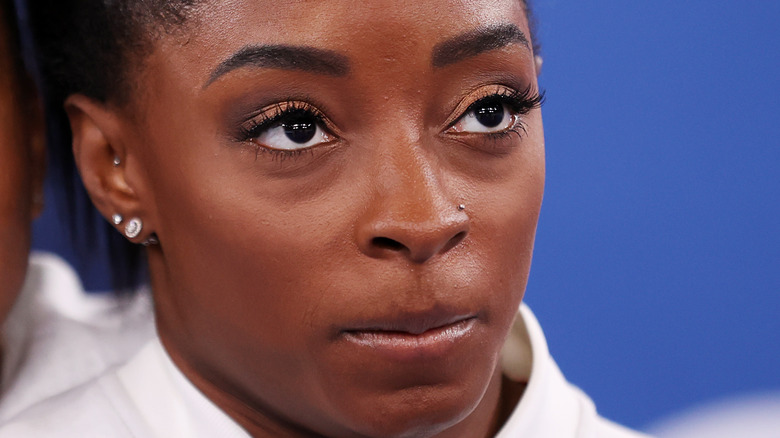 Simone Biles with Jordan Chiles in the background