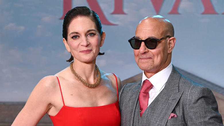 Stanley Tucci and wife Felicity Blunt posing and smiling at the "Rivals" season 2 premiere in London