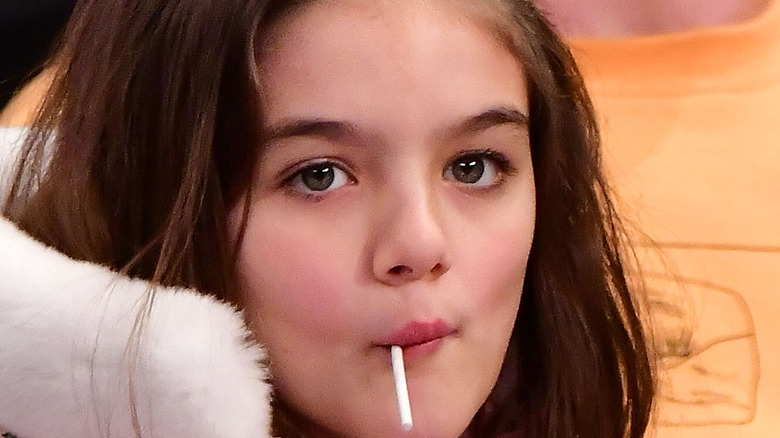Suri Cruise eating lollipop