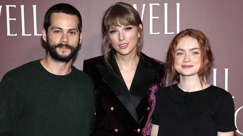 Taylor Swift, Sadie Sink, and Dylan O'Brien posing 