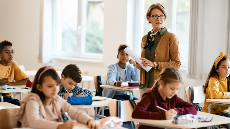 Teacher smiling in classroom