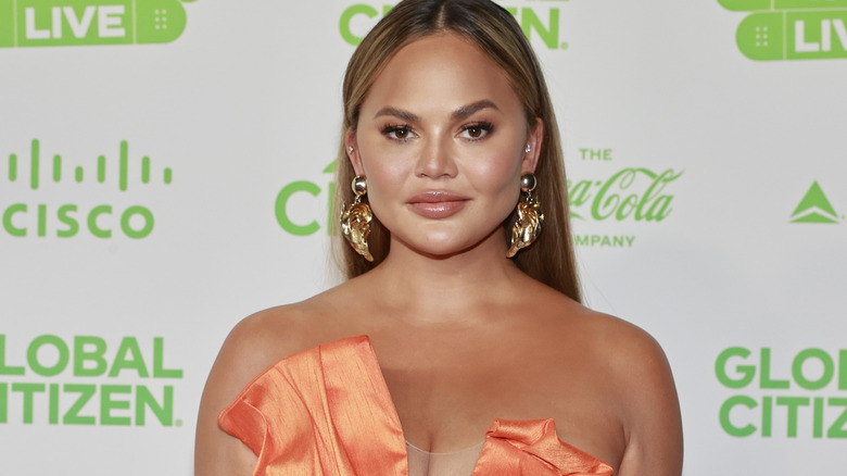 Chrissy Teigen posing at event