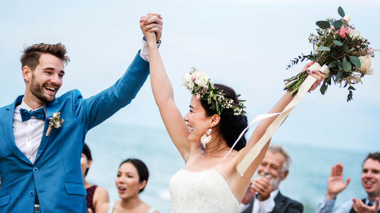 Bride and groom smile