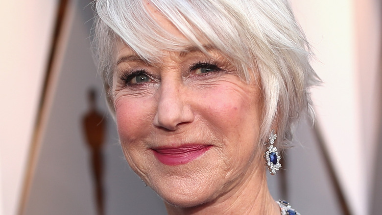 Dame Helen Mirren poses on the red carpet