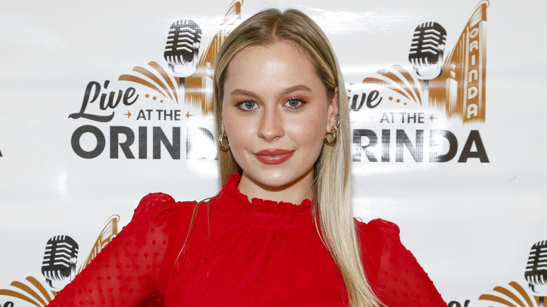 Natasha Bure posing at an event