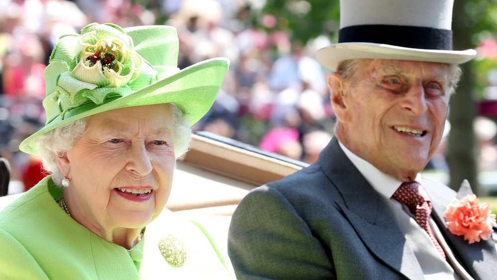 Prince Philip and Queen Elizabeth riding