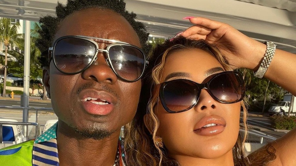 Michael Blackson and Rada take a selfie together with sunglasses