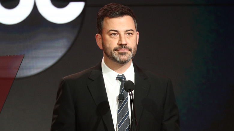 Jimmy Kimmel behind a microphone
