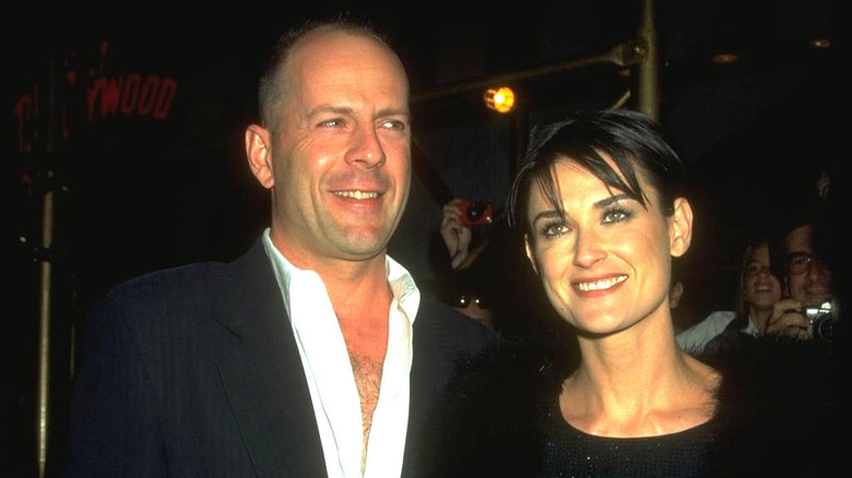 Demi Moore and Bruce Willis smiling at a movie premiere in 2000