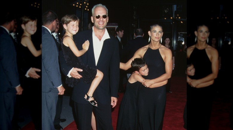 Demi Moore, Bruce Willis, and daughters Scout and Rumer at a red carpet event in 1996