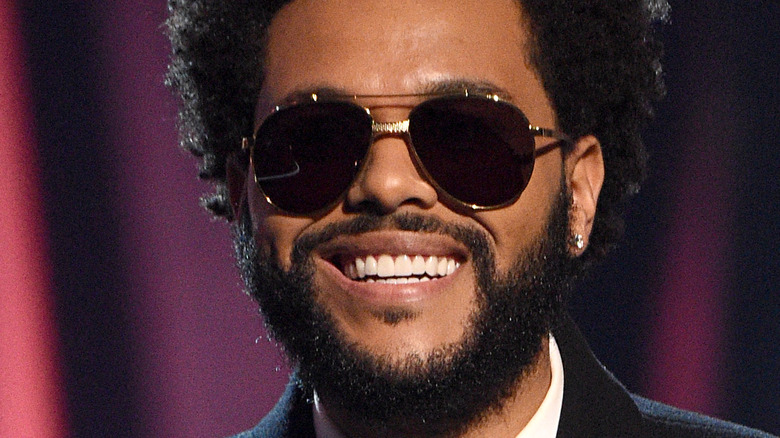 The Weeknd smiling at an event