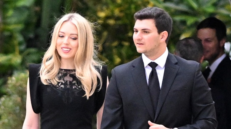 Tiffany Trump Michael Boulos smiling, walking